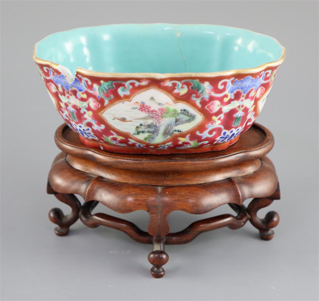 A Chinese ruby ground jardiniere, Daoguang mark and of the period (1821-50), 17cm wide, 6.5cm high, wood stand